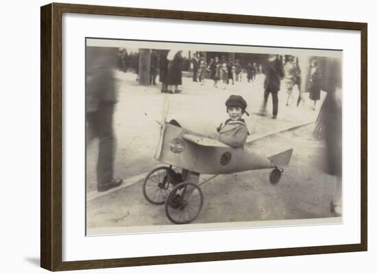 Boy in a Toy Aircraft-null-Framed Photographic Print