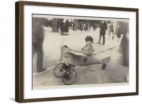 Boy in a Toy Aircraft-null-Framed Photographic Print