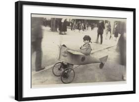 Boy in a Toy Aircraft-null-Framed Photographic Print