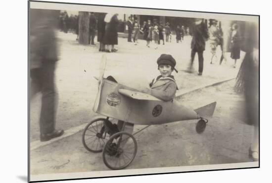 Boy in a Toy Aircraft-null-Mounted Photographic Print