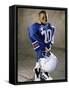 Boy in an Oversized Football Uniform Holding a Helmet-null-Framed Stretched Canvas