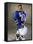 Boy in an Oversized Football Uniform Holding a Helmet-null-Framed Stretched Canvas