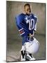 Boy in an Oversized Football Uniform Holding a Helmet-null-Mounted Photographic Print