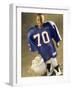 Boy in an Oversized Football Uniform Holding a Helmet-null-Framed Photographic Print