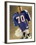 Boy in an Oversized Football Uniform Holding a Helmet-null-Framed Photographic Print