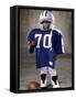 Boy in an Oversized Football Uniform Wearing a Helmet-null-Framed Stretched Canvas