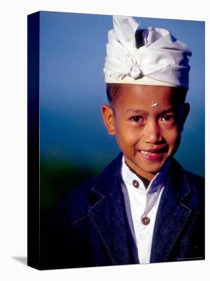 Boy in Formal Dress at Hindu Temple Ceremony, Indonesia-Merrill Images-Stretched Canvas