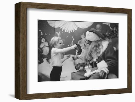 Boy Kissing African American Santa Claus in Unidentified Department Store. 1970-Ralph Morse-Framed Photographic Print