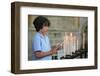 Boy lighting a church candle-Godong-Framed Photographic Print