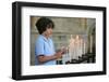 Boy lighting a church candle-Godong-Framed Photographic Print