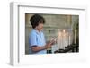 Boy lighting a church candle-Godong-Framed Photographic Print