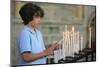 Boy lighting a church candle-Godong-Mounted Photographic Print