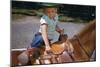 Boy Mounting Horse-William P. Gottlieb-Mounted Photographic Print
