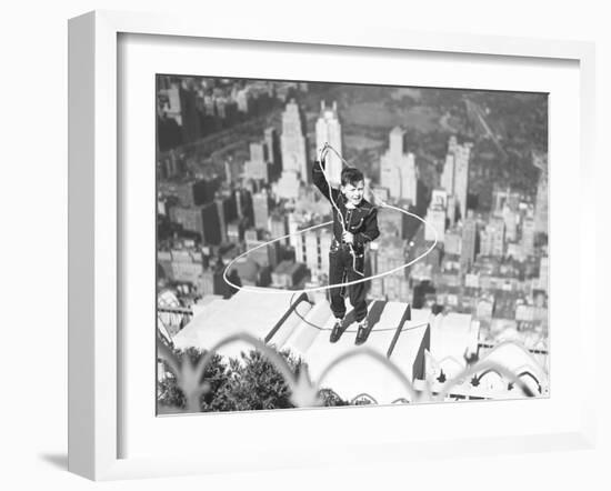 Boy on Ledge Twirling a Lasso-null-Framed Photographic Print