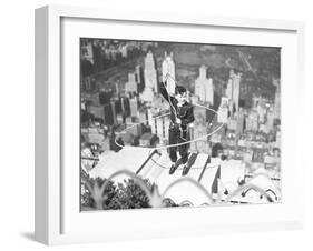 Boy on Ledge Twirling a Lasso-null-Framed Photographic Print