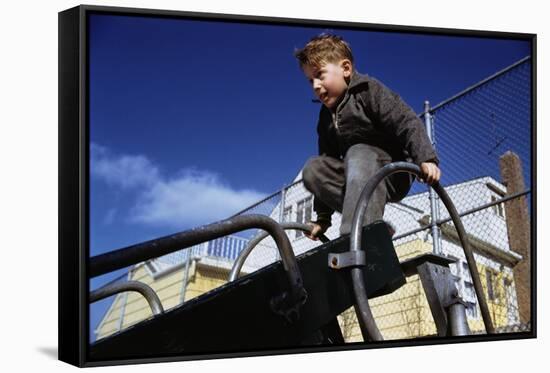 Boy Playing on Playground Slide-William P. Gottlieb-Framed Stretched Canvas