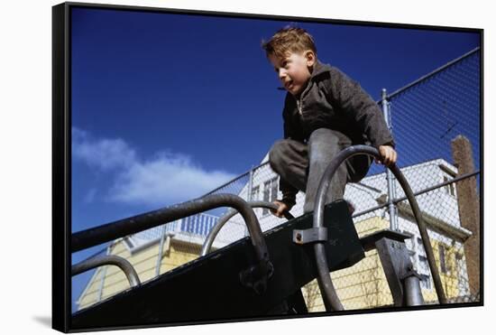 Boy Playing on Playground Slide-William P. Gottlieb-Framed Stretched Canvas