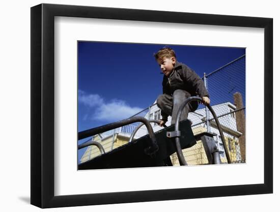 Boy Playing on Playground Slide-William P. Gottlieb-Framed Photographic Print