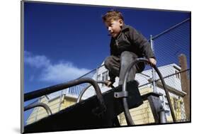 Boy Playing on Playground Slide-William P. Gottlieb-Mounted Photographic Print