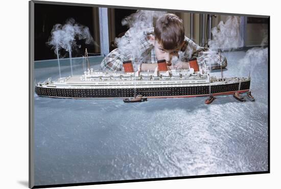 Boy Playing with Toy Ocean Liner-William P. Gottlieb-Mounted Photographic Print