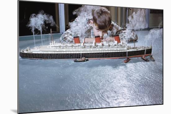 Boy Playing with Toy Ocean Liner-William P. Gottlieb-Mounted Photographic Print