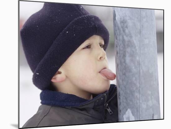 Boy Putting Tongue to Frozen Pole-Dann Tardif-Mounted Photographic Print