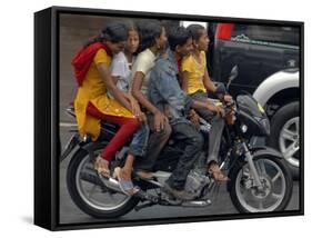 Boy Rides a Motorbike with Four Girls, as it Drizzles in Hyderabad, India-null-Framed Stretched Canvas