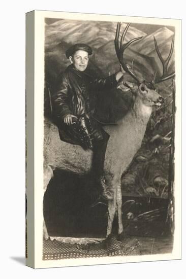 Boy Riding Stuffed Deer-null-Stretched Canvas
