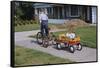 Boy Riding Tricycle and Towing Wagon-William P. Gottlieb-Framed Stretched Canvas