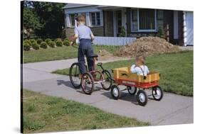 Boy Riding Tricycle and Towing Wagon-William P. Gottlieb-Stretched Canvas