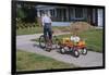 Boy Riding Tricycle and Towing Wagon-William P. Gottlieb-Framed Photographic Print