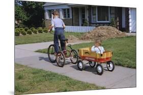 Boy Riding Tricycle and Towing Wagon-William P. Gottlieb-Mounted Photographic Print