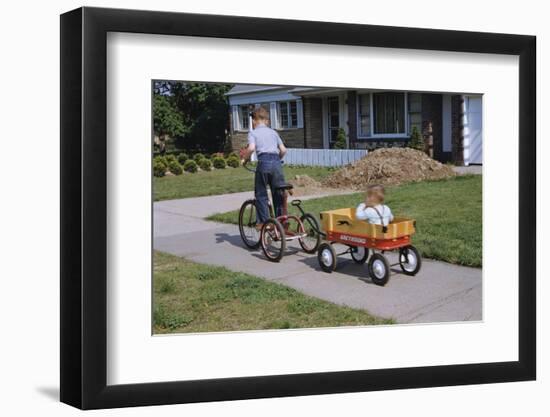 Boy Riding Tricycle and Towing Wagon-William P. Gottlieb-Framed Photographic Print