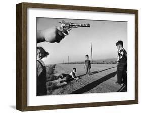 Boy's Hand Holding a Toy Six Shooter Pistol During a Game of "Cops and Robbers"-Howard Sochurek-Framed Photographic Print