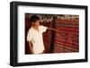 Boy showing a rug in a carpet shop, Toujane, Tunisia-Godong-Framed Photographic Print