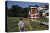 Boy Sitting on Fence Waving to Friend-William P. Gottlieb-Stretched Canvas