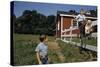 Boy Sitting on Fence Waving to Friend-William P. Gottlieb-Stretched Canvas