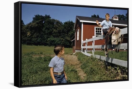 Boy Sitting on Fence Waving to Friend-William P. Gottlieb-Framed Stretched Canvas