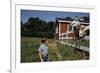 Boy Sitting on Fence Waving to Friend-William P. Gottlieb-Framed Photographic Print