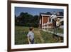 Boy Sitting on Fence Waving to Friend-William P. Gottlieb-Framed Photographic Print