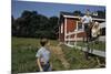 Boy Sitting on Fence Waving to Friend-William P. Gottlieb-Mounted Photographic Print