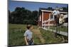 Boy Sitting on Fence Waving to Friend-William P. Gottlieb-Mounted Photographic Print