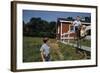 Boy Sitting on Fence Waving to Friend-William P. Gottlieb-Framed Photographic Print