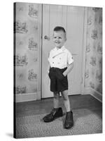 Boy Standing in Oversized Shoes-Philip Gendreau-Stretched Canvas