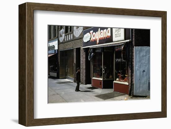 Boy Standing Outside Toyland-William P. Gottlieb-Framed Photographic Print