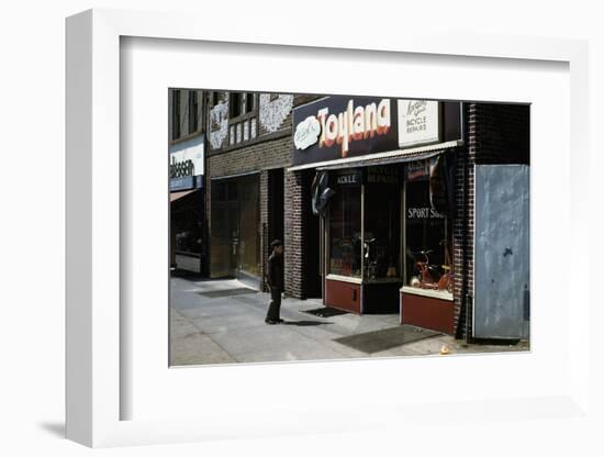 Boy Standing Outside Toyland-William P. Gottlieb-Framed Photographic Print