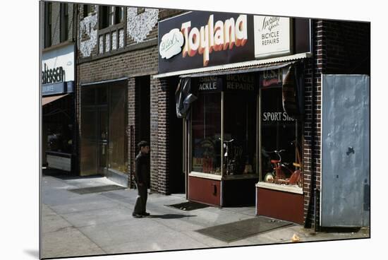 Boy Standing Outside Toyland-William P. Gottlieb-Mounted Photographic Print
