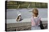 Boy Standing with Kitten in Schoolyard-William P. Gottlieb-Stretched Canvas