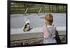 Boy Standing with Kitten in Schoolyard-William P. Gottlieb-Framed Photographic Print