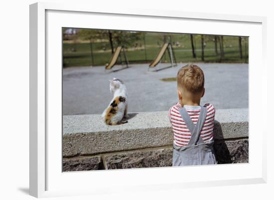 Boy Standing with Kitten in Schoolyard-William P. Gottlieb-Framed Photographic Print